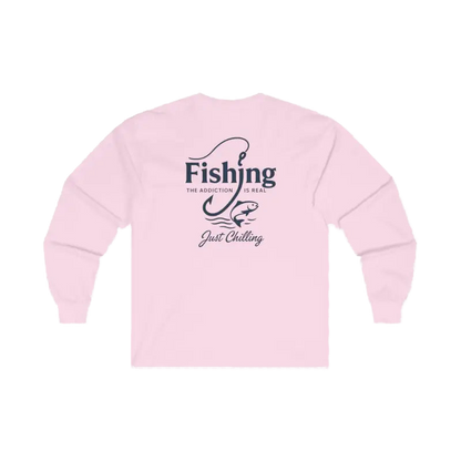 A pink long-sleeved shirt with a graphic design on the back, featuring the text "Fishing is the addiction. Just chilling."