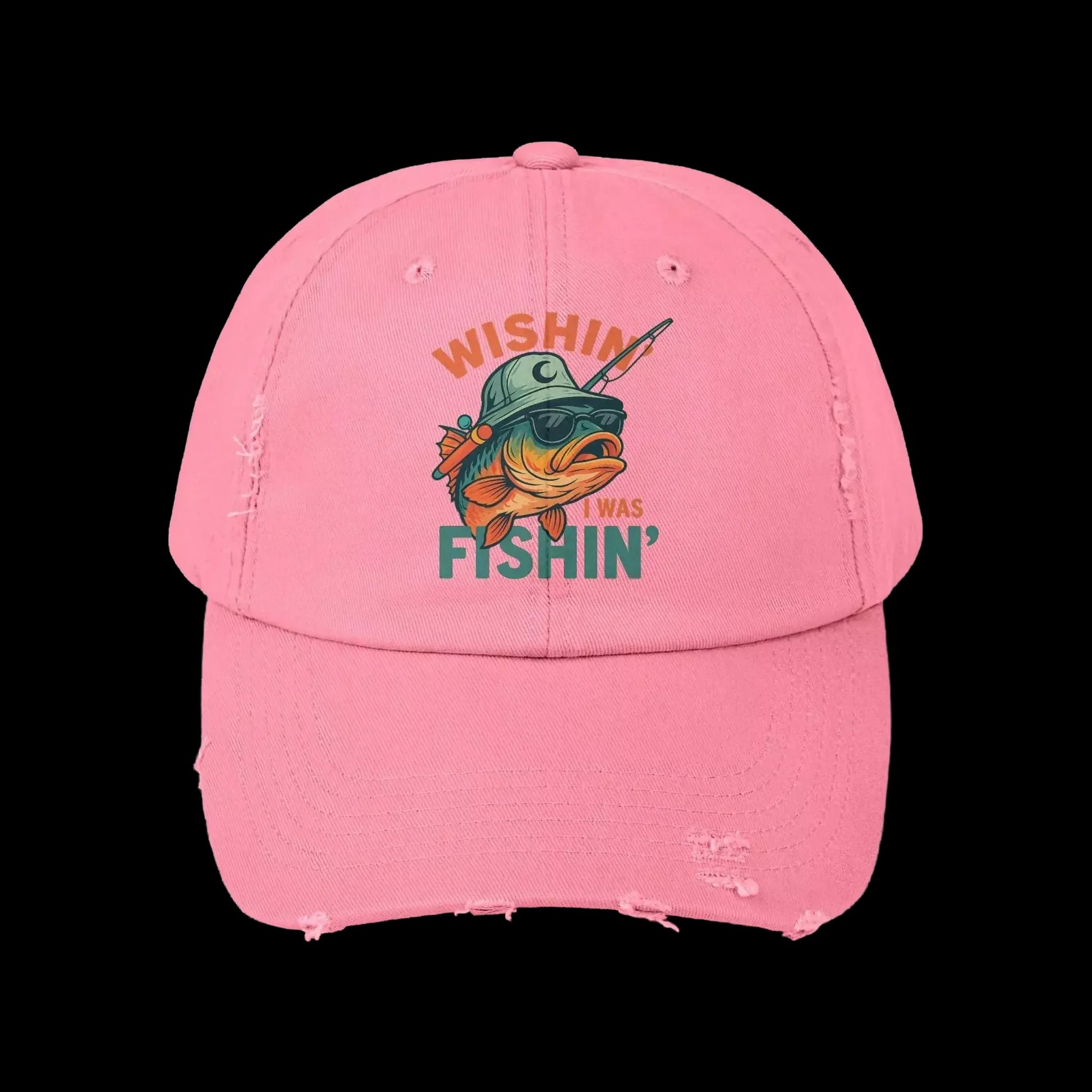 A pink baseball cap with a graphic of a fish wearing a hat and sunglasses, along with the text "Wishin' I was FISHIN'" printed on it.