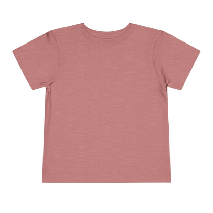 A plain, solid pink t-shirt is shown against a black background.