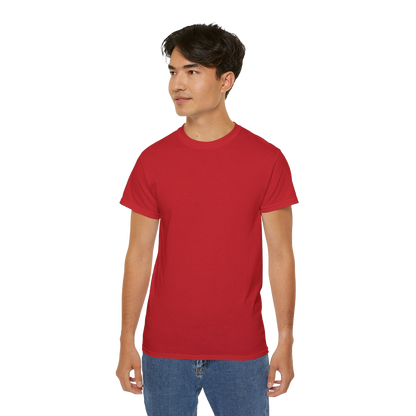 A young man wearing a red t-shirt stands against a black background.