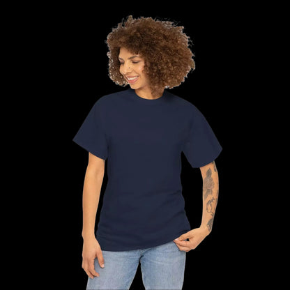 A woman with curly hair is smiling and looking down at her hand.