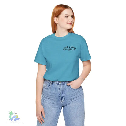 Woman wearing a blue t-shirt and jeans.