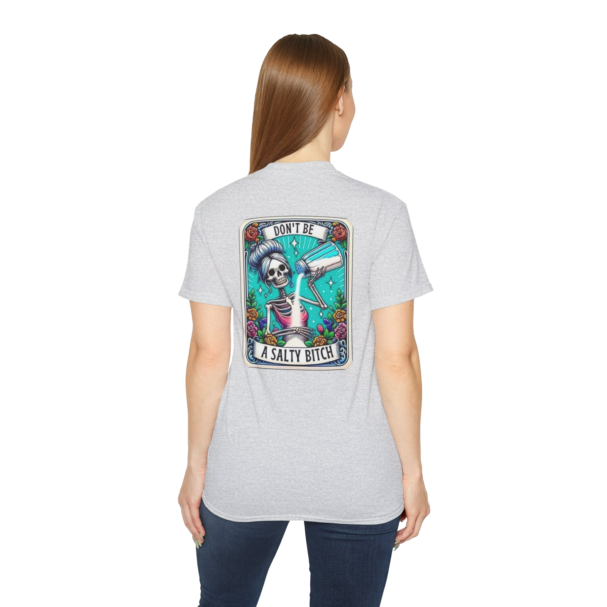 A woman wearing a gray t-shirt with a graphic design on the back.