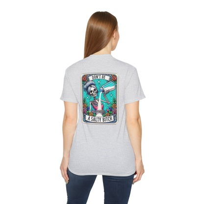 A woman wearing a gray t-shirt with a graphic design on the back.