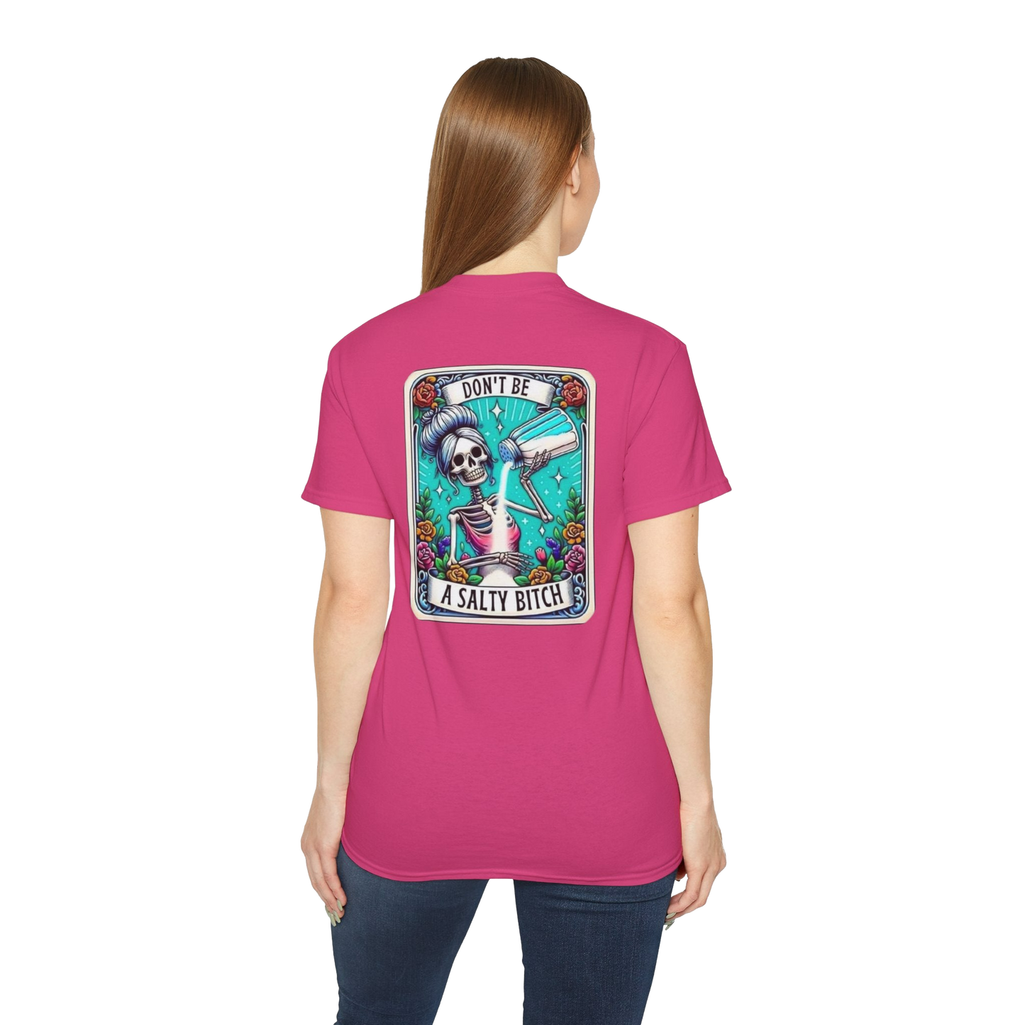 A woman wearing a pink t-shirt with a graphic design on the back.