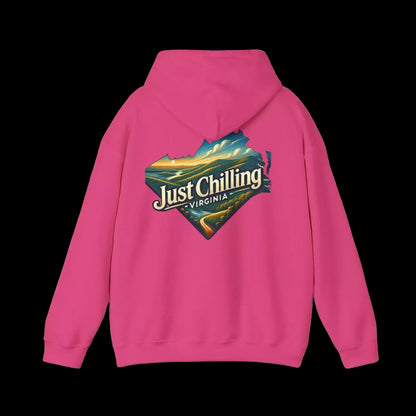 A bright pink hoodie with a graphic design on the back, featuring a scenic landscape with mountains and a body of water.