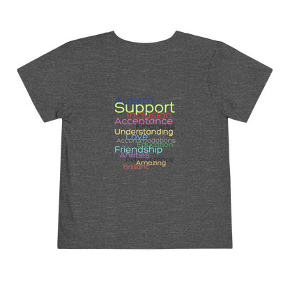 The image is a gray t-shirt with a colorful graphic design on the back, featuring a list of positive words and phrases in a rainbow color scheme.