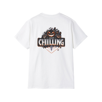 A white t-shirt with a graphic design featuring a pumpkin and the text "Just Chilling" on the back.