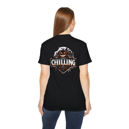 A woman wearing a black t-shirt with a graphic design on the back.