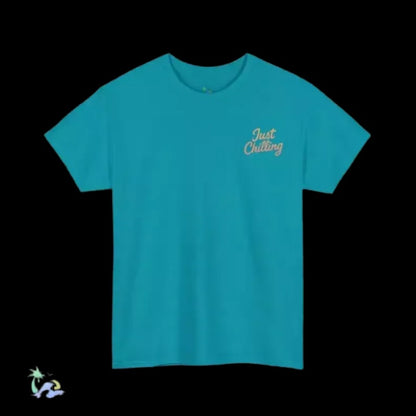A turquoise t-shirt with the text "Just Chilling" printed on the left side.