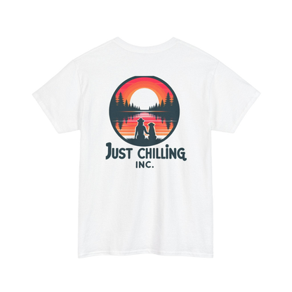 A white t-shirt with a graphic design featuring a sunset and silhouettes of people sitting on a bench.