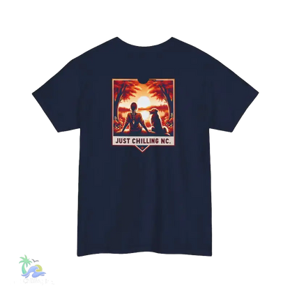 A navy blue t-shirt with a graphic design depicting two silhouetted figures sitting together in a natural setting, with a sunset in the background. The text "JUST CHILLING MC" is displayed below the image.