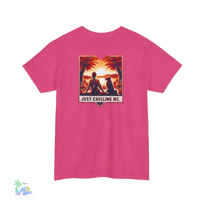 A pink t-shirt with a graphic design featuring a sunset scene with silhouetted figures.