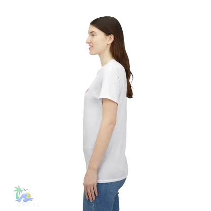 A woman with long brown hair is standing in profile, wearing a white t-shirt and blue jeans.