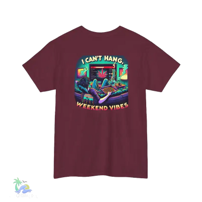 A maroon t-shirt with a colorful graphic design depicting a person lounging in a chair with a computer monitor, surrounded by various objects and text that reads "I CAN'T HANG. WEEKEND VIBES".