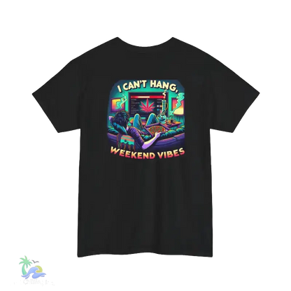 A black t-shirt with a colorful graphic design depicting a person lounging on a couch with a computer monitor in front of them, surrounded by various objects and text.