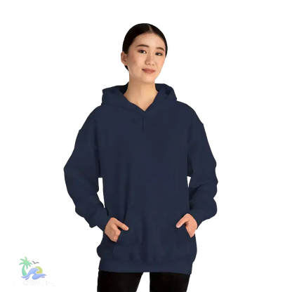 A woman wearing a navy blue hoodie stands against a black background.