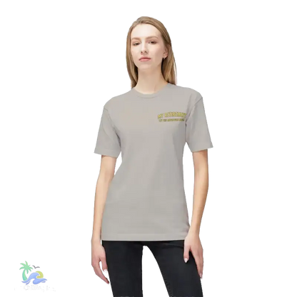 A woman wearing a grey t-shirt with a yellow text logo on the left side of her chest.