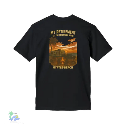 The image is a black t-shirt with a graphic design depicting a beach scene at sunset, featuring palm trees, a car, and a train.