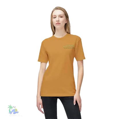 A woman wearing a yellow t-shirt with a logo stands against a black background.