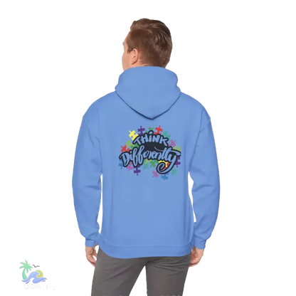 A person wearing a blue hoodie with a colorful graphic and text on the back.