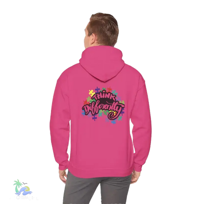 A person wearing a pink hoodie with a colorful graphic and text on the back.