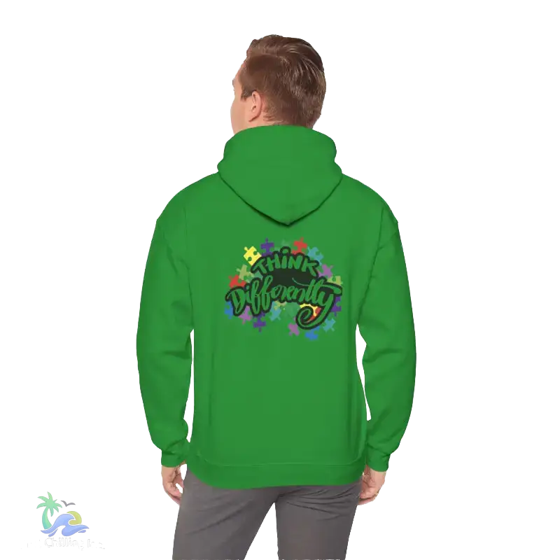 A person wearing a green hoodie with a colorful graphic and text on the back.