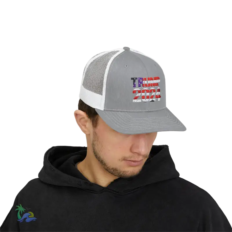 a man wearing a gray and white american flag hat