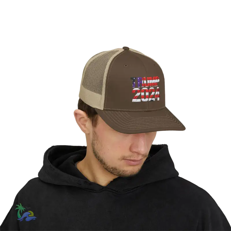 a man wearing a brown and tan trucker hat