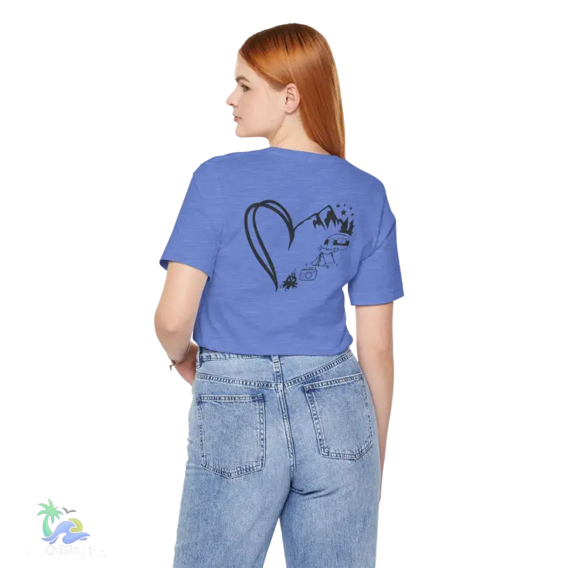 a woman wearing a blue t - shirt with a heart drawn on it