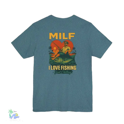 A t-shirt with a graphic design depicting a man fishing and a woman sitting on a rock, with the text "MILF I LOVE FISHING Just Chilling" printed on it.