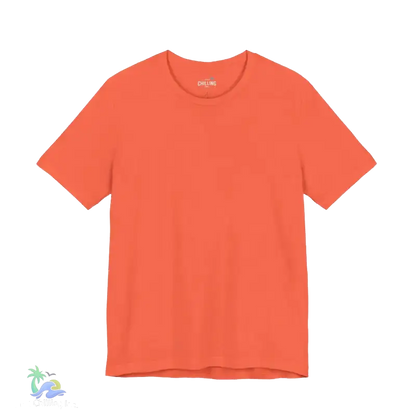 A bright orange t-shirt is shown against a black background.