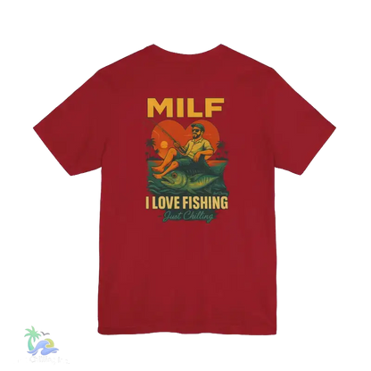 A red t-shirt with a graphic design depicting a man fishing and the text "MILF I LOVE FISHING Just Chilling" printed on it.