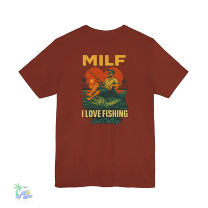 A red t-shirt with a graphic design depicting a man fishing and the text "MILF I LOVE FISHING Just Chilling" printed on it.