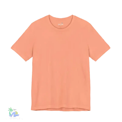 A simple peach-colored t-shirt is shown against a black background.