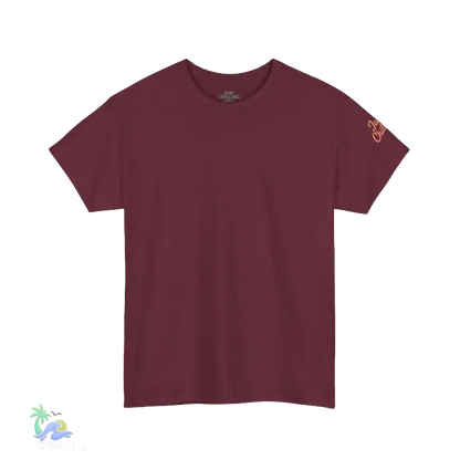 A maroon-colored t-shirt is shown against a black background.
