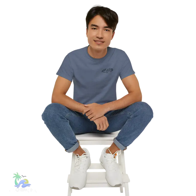 a man sitting on top of a white step stool