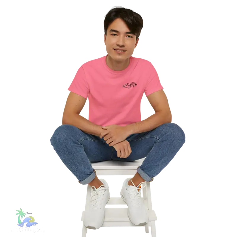 a man sitting on top of a white step stool