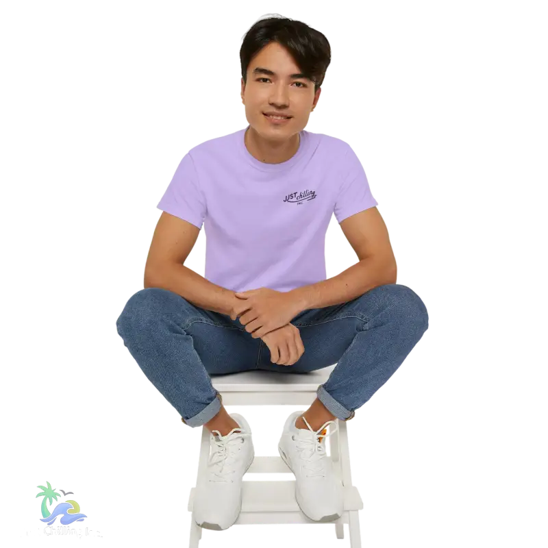 a man sitting on top of a white chair