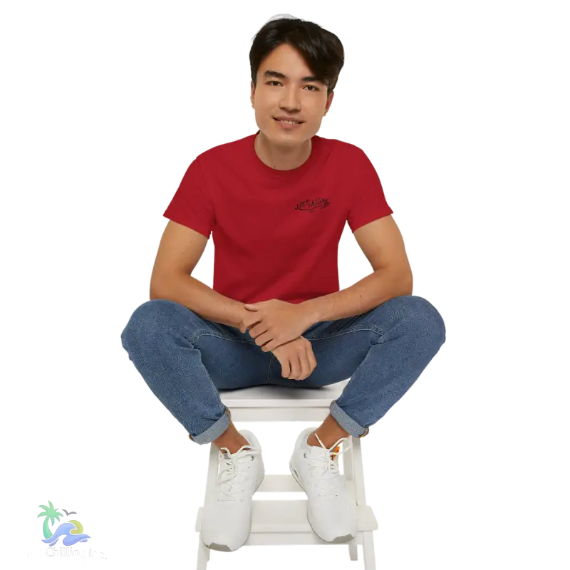 a man sitting on top of a white step stool