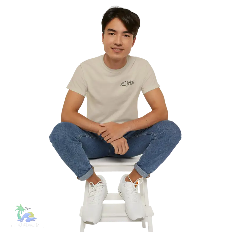 a man sitting on top of a white step stool