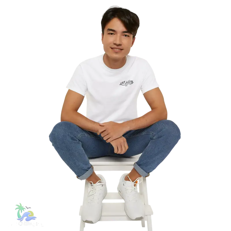 a man sitting on top of a white chair