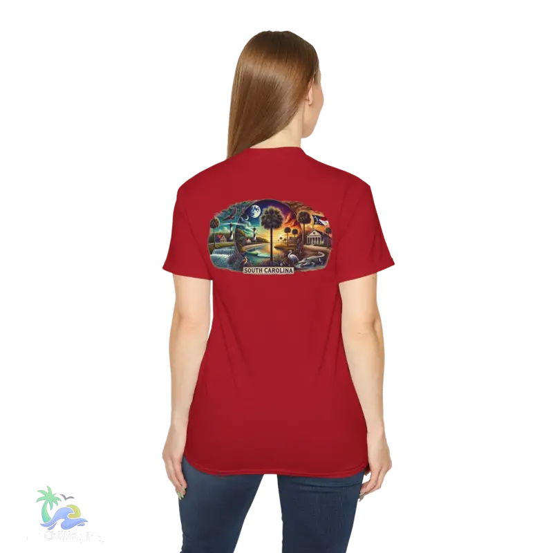 a woman wearing a red t - shirt with a picture of a train on it