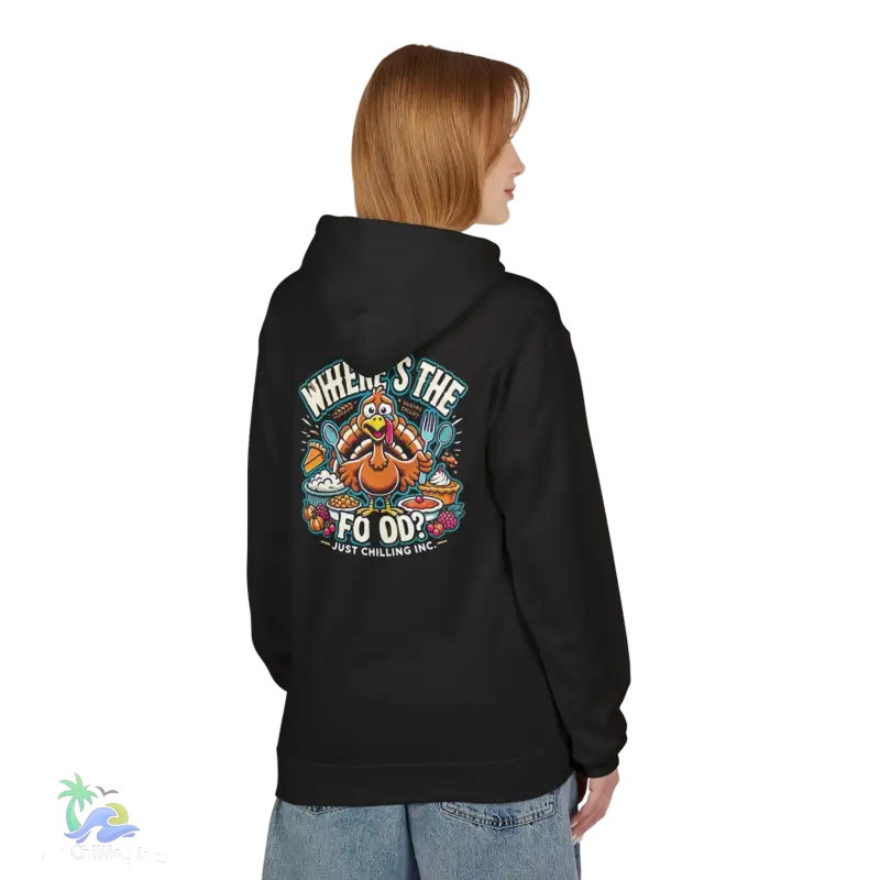 a woman wearing a black hoodie with an image of a pumpkin on it